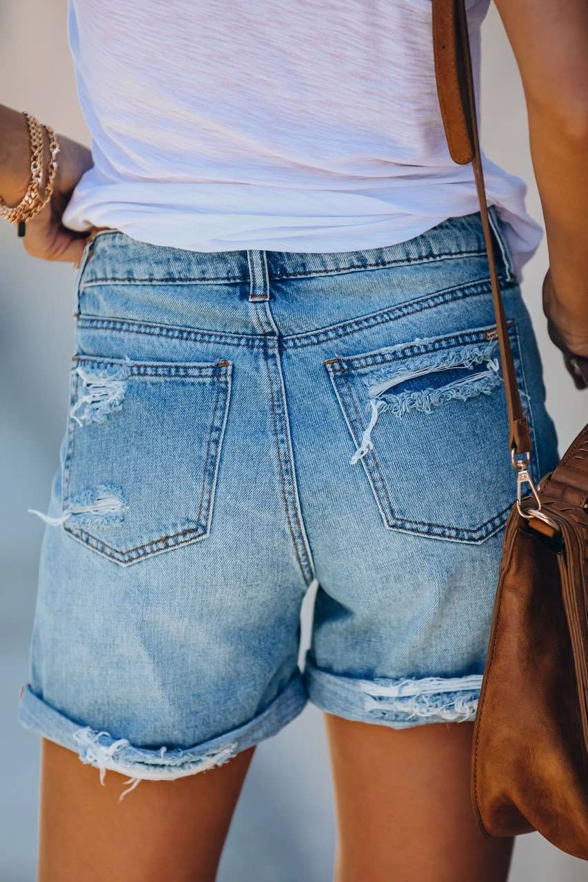 Vintage wash high rise ripped fringed denim shorts