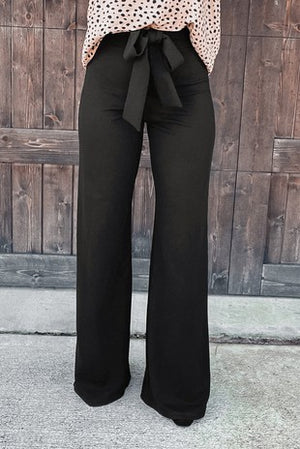 Black high waist front tie flared pants.